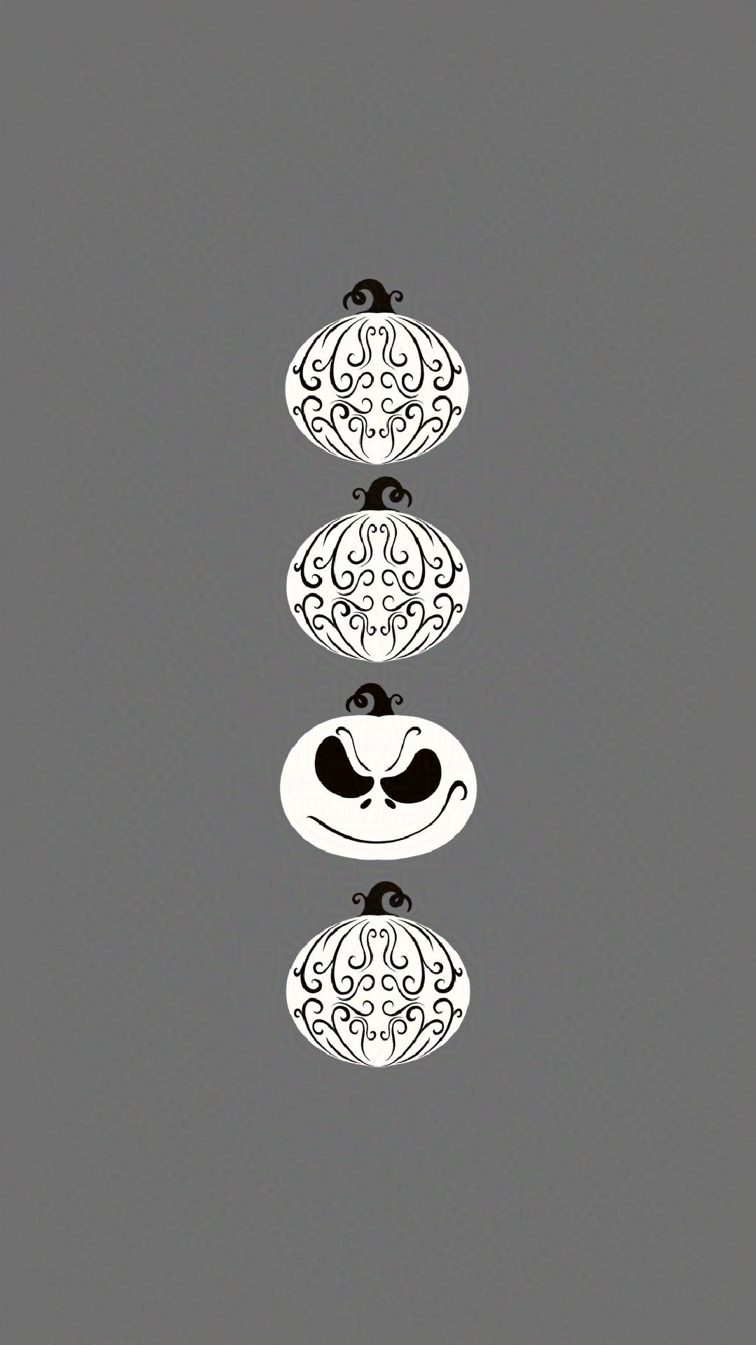 four decorative pumpkins - three with intricate designs and one with a jack skellington-inspired face on a gray background