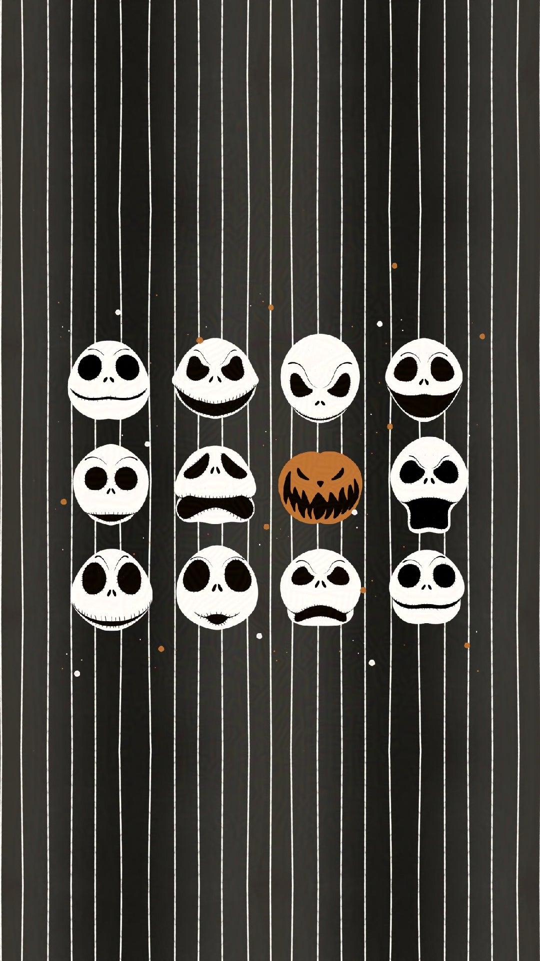 set of Jack Skellington inspired faces and a pumpkin on a black and white striped background